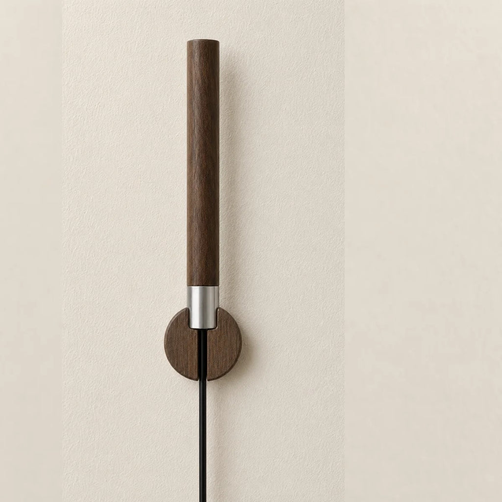The Chaser held in its walnut Cradle, wall-mounted